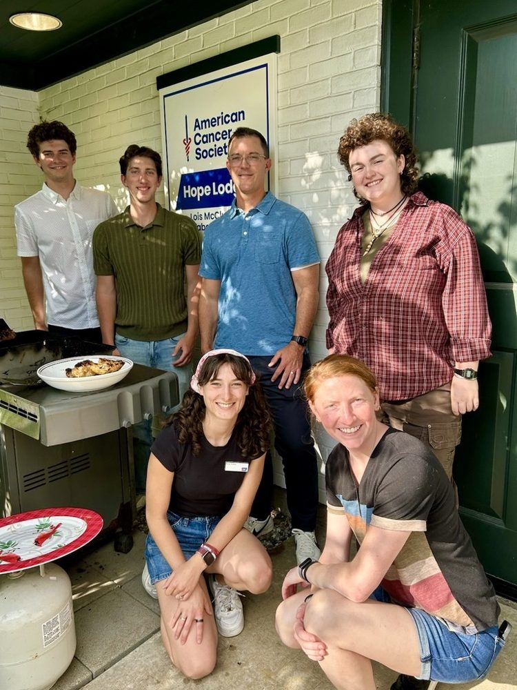 Six lab members outside the American Cancer Society Hope Lodge